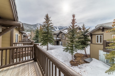 Step outside to pine trees and snow-capped peaks beyond