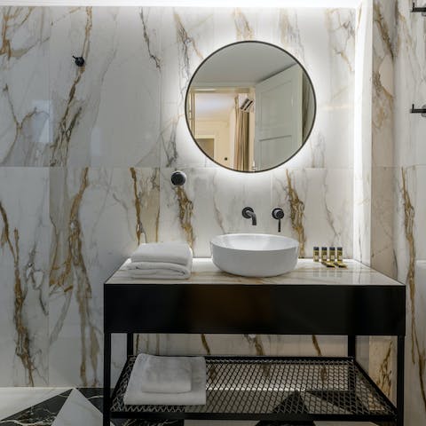 Get ready in the marble-clad bathroom for a night out in Athens