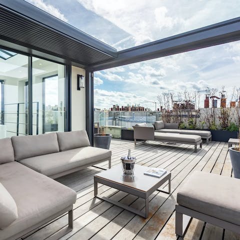Make Champagne cocktails on the rooftop terrace the new routine