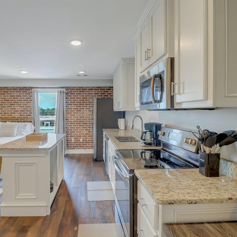 Rustle up a quick bite to eat in the sleek kitchen