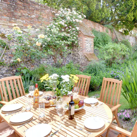 Have a wine and cheese evening on the patio in the pretty walled garden