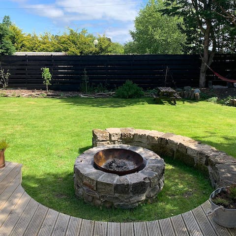 Gather around the firepit to keep warm in the evening