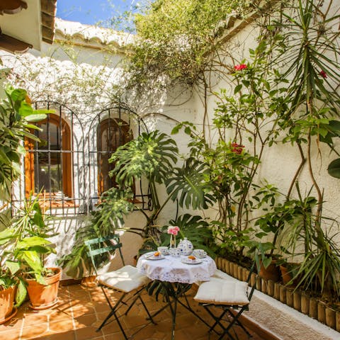 Enjoy your morning coffee in the leafy courtyard