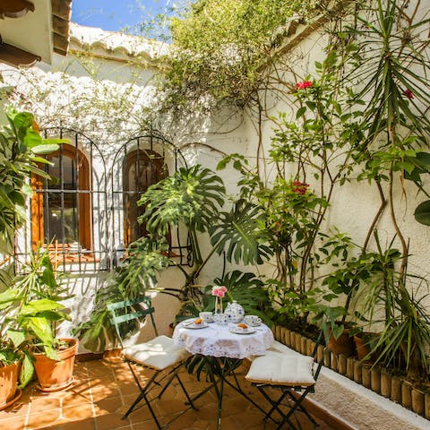 Enjoy your morning coffee in the leafy courtyard