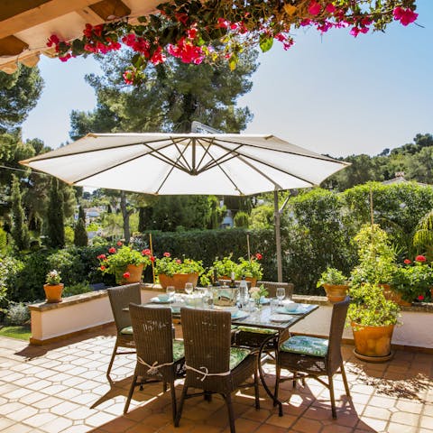 Sit down to a Spanish-inspired dinner beneath sprays of bougainvillea