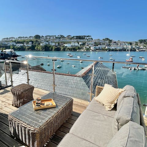 Enjoy sundowners on the terrace while watching boats glide by