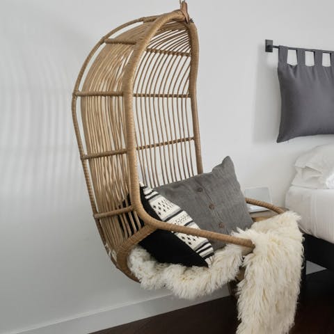 Find a comfy reading spot on the egg-shaped swing seat