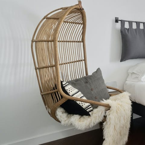 Find a comfy reading spot on the egg-shaped swing seat