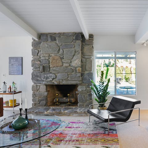 Cosy up in front of the stone fireplace on chilly desert evenings