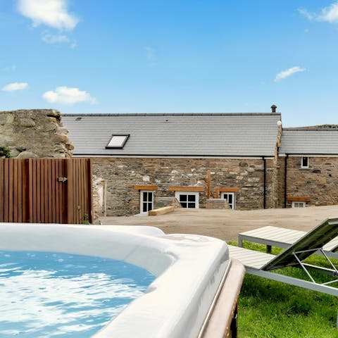 Kick back in the hot tub with a cold drink