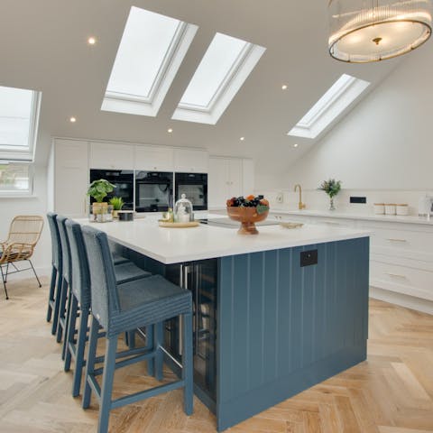 Enjoy your avocados on toast with the sleek three-oven kitchen and chic breakfast bar