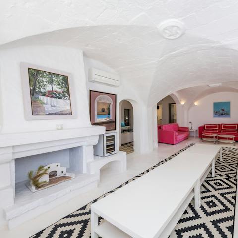 Stay in one of Menorca's oldest farmhouses, vaulted ceilings and old fireplace still on display