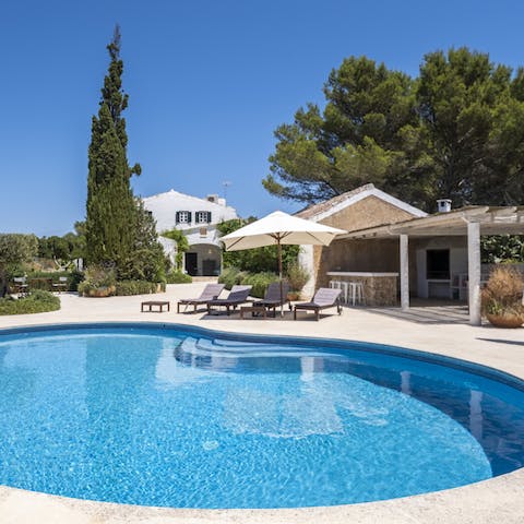 Float the day away in the kidney-shaped swimming pool