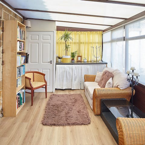 Grab a book from the shelves and find a cosy place to read in one of the two sunrooms