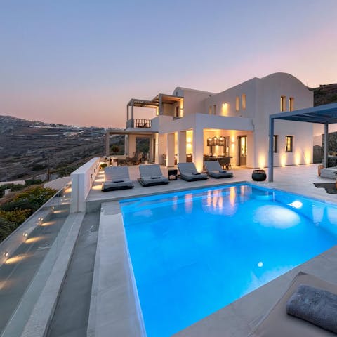 Sip local ouzo while watching the sun set from the terrace