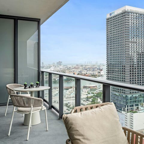 Sip your morning coffee at the outdoor table on your private balcony
