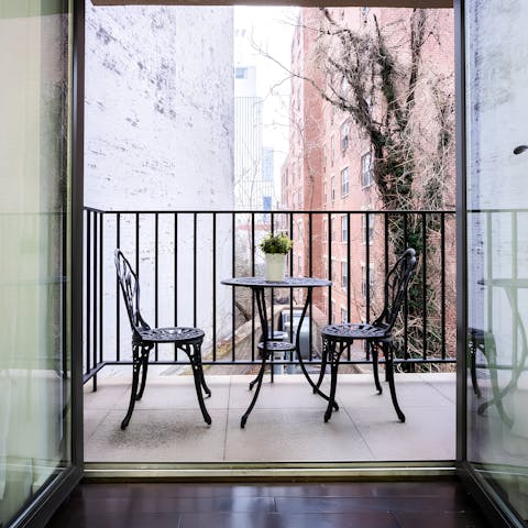 Sip your morning coffee on the balcony as NYC wakes below