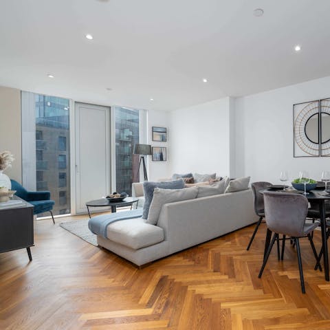 Watch the world go by from the floor-to-ceiling windows in the living room