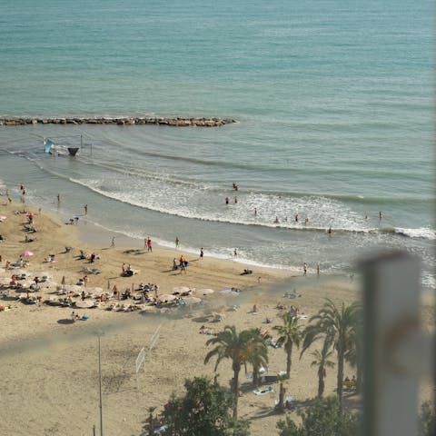 Sink your toes into sand – Postiguet Beach is just steps away