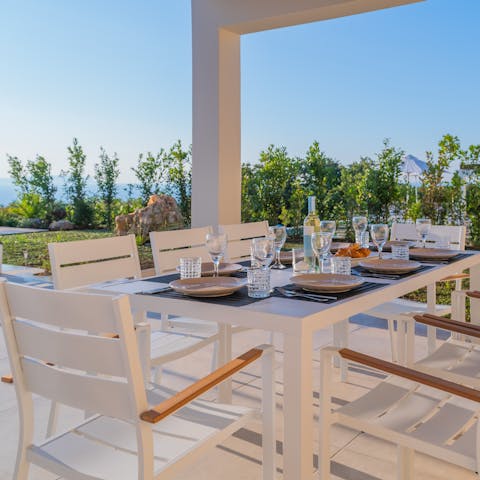 Dine alfresco on the covered terrace as the sea provides the perfect backdrop