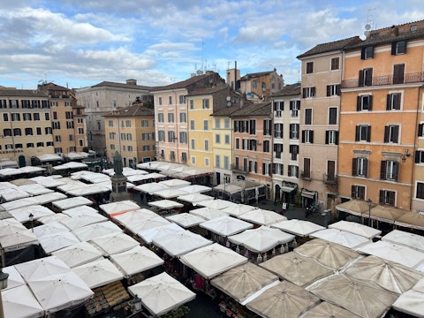 Discover local delicacies at the bustling Campo de' Fiori market