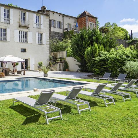 Lounge around the swimming pool amidst the tranquil garden setting