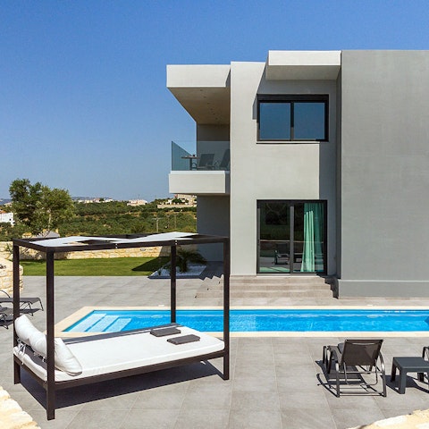 Spend lazy days lounging by the swimming pool