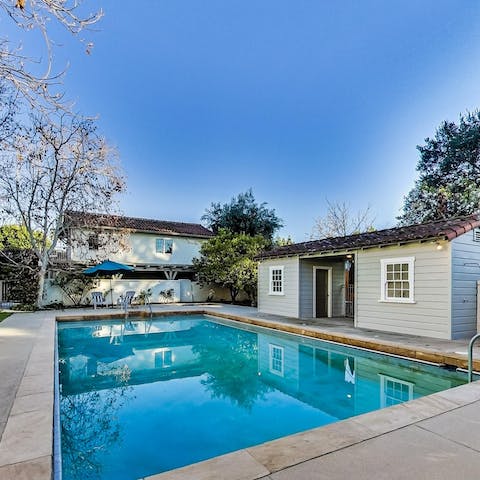 Glide gracefully through the home's expansive pool