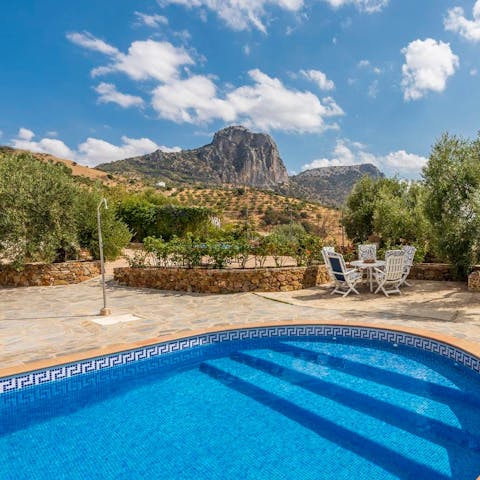 Swim in the pool with a glorious view of the mountains