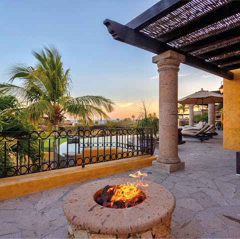 Warm up around the fire pit as the night breeze comes in