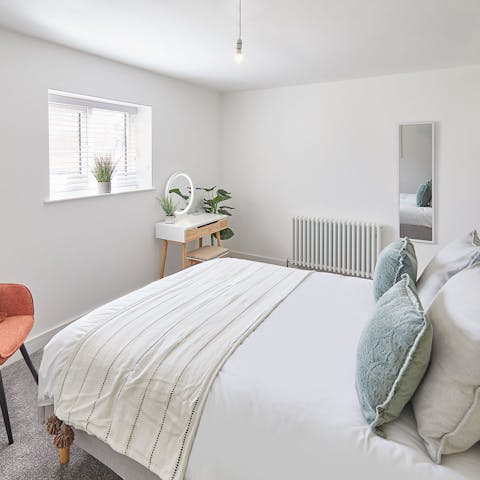 Wake up in the stylish bedroom, feeling rested and ready to hit the beach