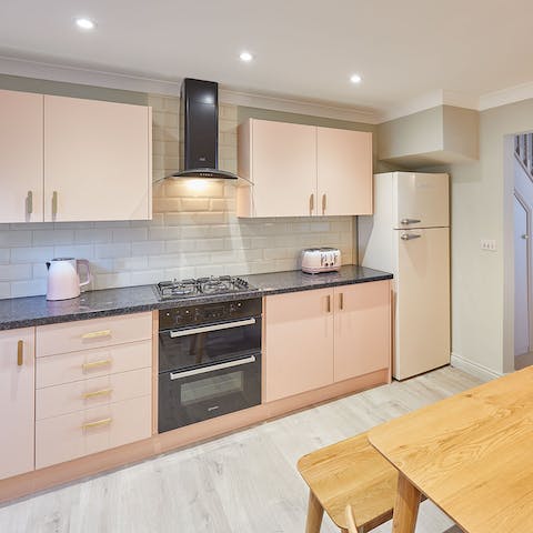 Fire up the coffee machine in the sleek, modern kitchen