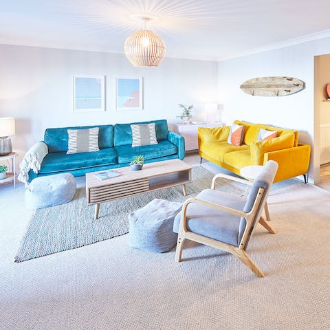 Spill out into the fresh and bright living room, there's room for you all