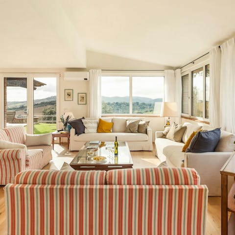 Take in the views over the Tuscan countryside from the living room
