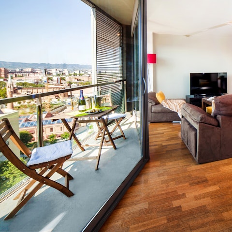 Sit out on the balcony with a book in hand after a day of exploring Barcelona