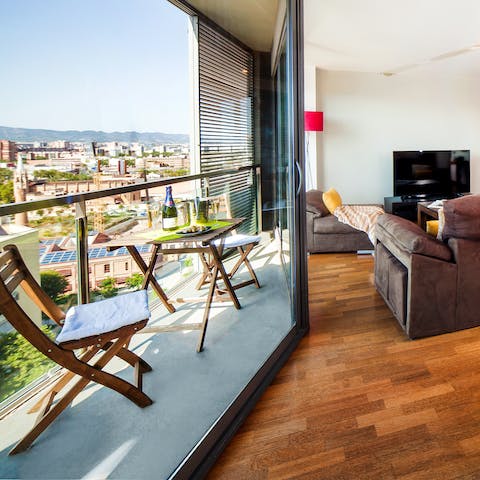 Sit out on the balcony with a book in hand after a day of exploring Barcelona