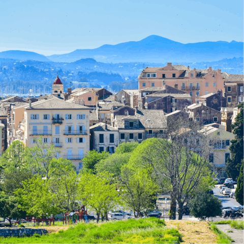 Stroll through the narrow streets of historic Corfu town – it's a short drive away