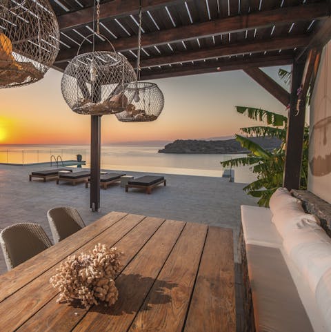 Tuck into alfresco feasts beneath the stylish pergola