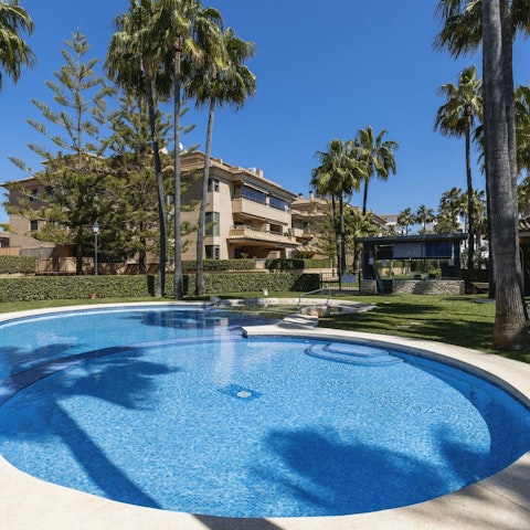 Swim in the communal pool to cool off in the Spanish heat