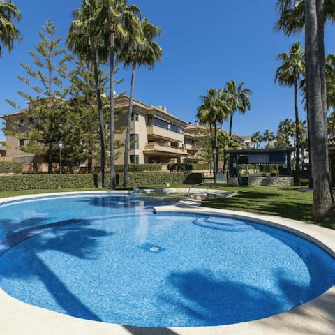 Swim in the communal pool to cool off in the Spanish heat