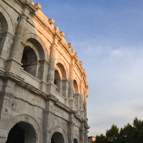 Explore the historic city of Nîmes, just a thirty-minute drive away