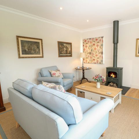 Cuddle up by the wood burner after a day exploring the local area