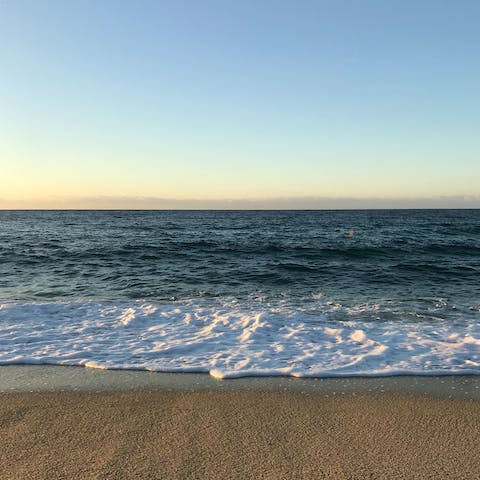 Be within a five-minute walk of gorgeous sandy beaches