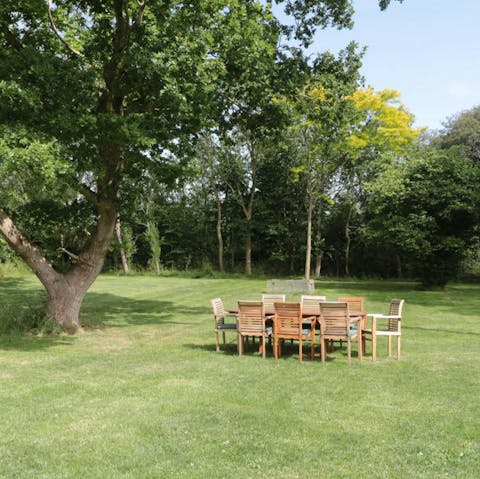 Dine alfresco beneath the trees in the enclosed garden