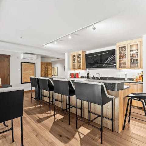 Gather at the bar to wind down after a busy day