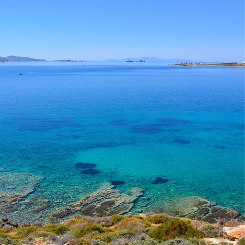 Swim in the blue water of the beach, just a three-minute walk away