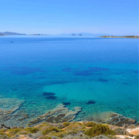 Swim in the blue water of the beach, just a three-minute walk away