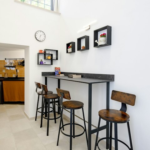 Perch on the breakfast bar for a quick cappuccino and croissant