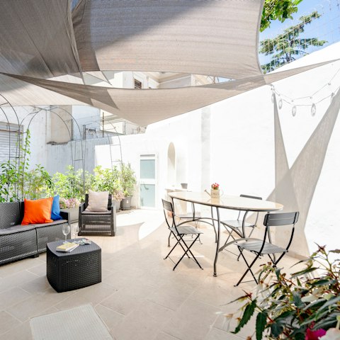 Dine alfresco on the sun-dappled patio