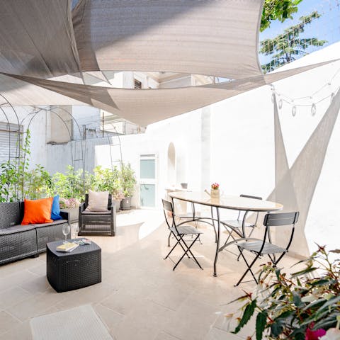 Dine alfresco on the sun-dappled patio